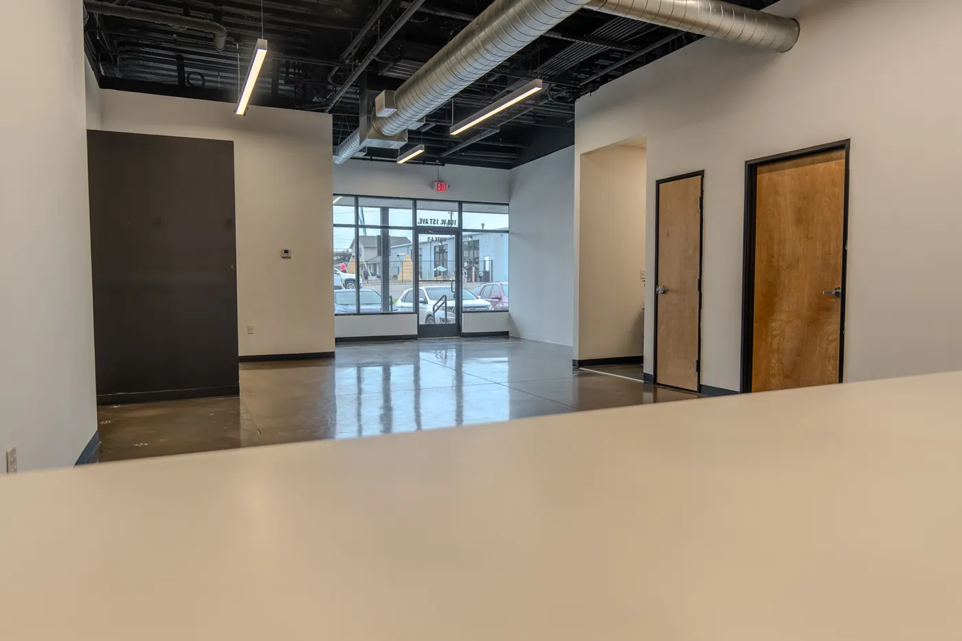 View from behind the bar toward the entrance at 108 W 1st Ave, Suite A-1