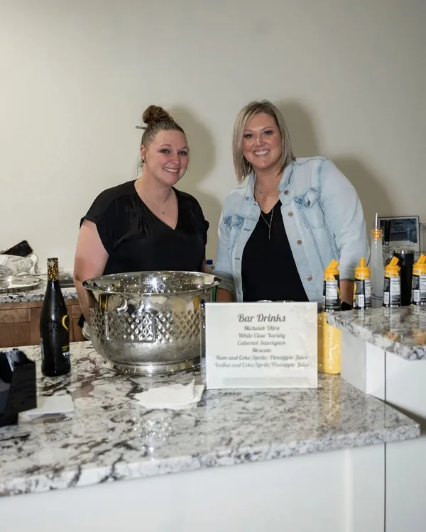 Bartender preparing drinks behind the bar